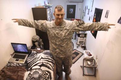 Pvt. Chris Walters shows off his living quarters at FOB Marez in Mosul, Iraq.