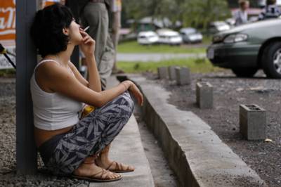 In San Ramon, a traveler takes a break from her bus ride.