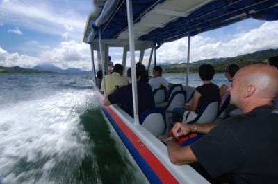 A boat takes us across Laguna de Arenal.  The volcano is visible on the horizon.