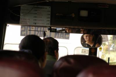 A woman watches as our bus pulls into the station at San Carlos.