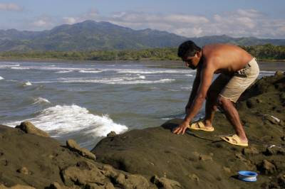 A man tends to his fishing line