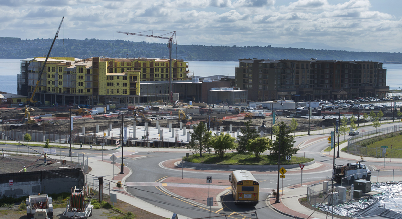 More than half of the 97-acre $1.2 billion urban village project, including the huge parking garage in the foreground, lies within Ruston. On the Tacoma side in the background, is the Century Building, which will house a nine-screen theater, and the Copperline apartment complex. (Drew Perine, staff photographer.)