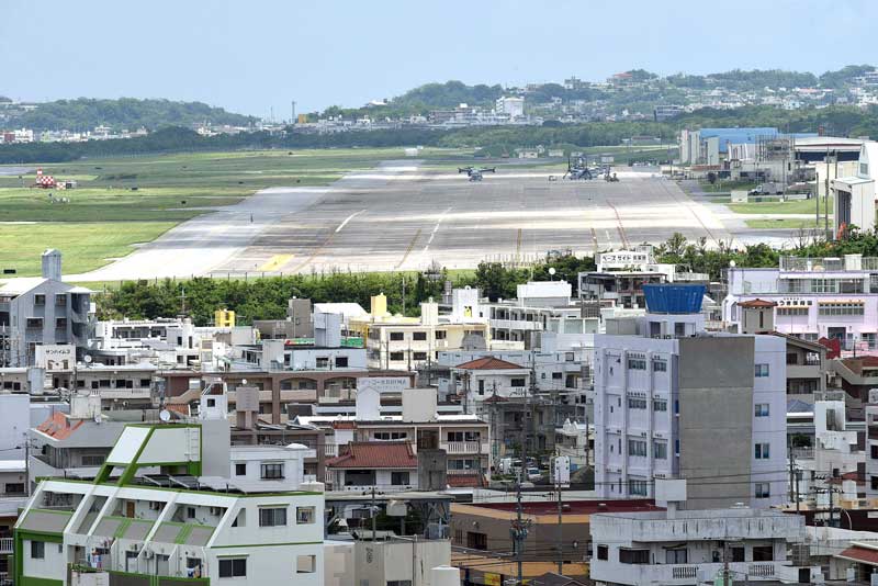 Kakazu Heights in Ginowan was the location of a fierce battle in World War II and is now a park which overlooks the Marine Corps Air Station Futenma in Okinawa, Japan, where V22 Ospreys can be seen parked on the air strip. Many Okinawans want Futenma to close, believing the base is dangerous. (Tiffany Tompkins-Condie, McClatchy.)