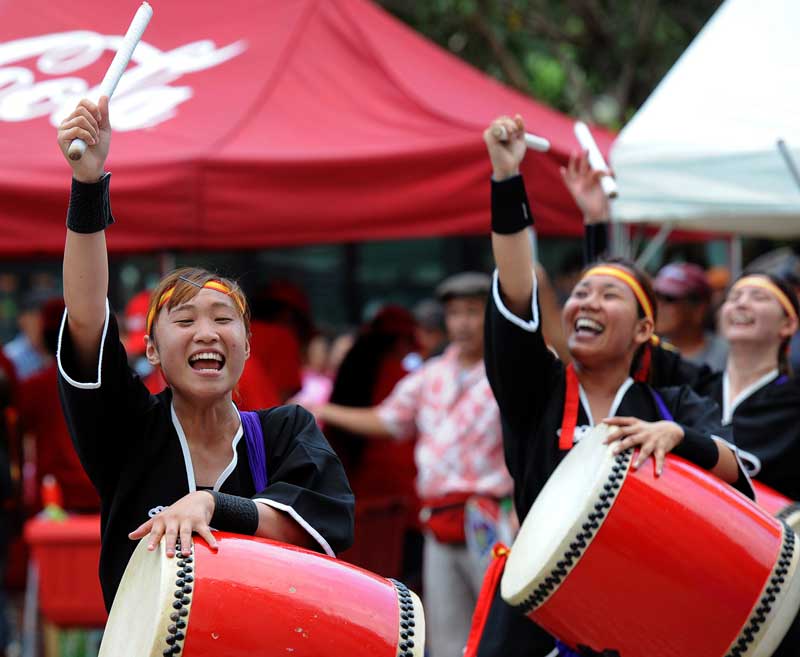 Eisa folk dancers perform in Naha, Okinawa, Japan, during a summer festival. Okinawans have a distinct culture and language from mainland Japan, one they try to keep flourishing with festivals and parades. (Tiffany Tompkins-Condie, McClatchy.)