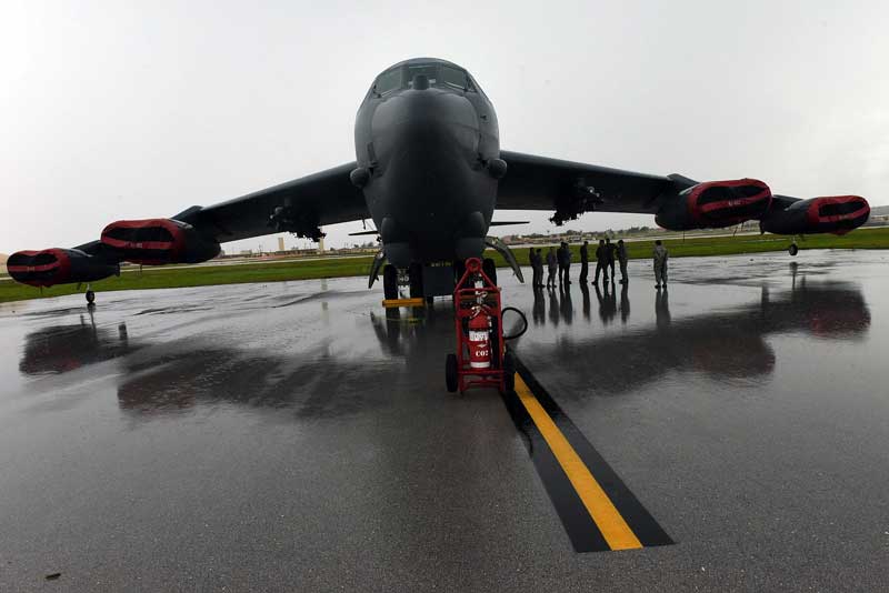 A B-52 bomber sits on the tarmac at Andersen Air Force Base in northern Guam, where they fly to demonstrate U.S. air power in the Pacific near contested islands in the East China Sea that China and Japan have both claimed. Photo taken Aug. 6, 2015. (Tiffany Tompkins-Condie, McClatchy.)