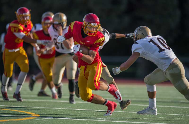 Jesuit running back and Stanford commit Beau Bisharat, left, runs down the field against the Yuba City Honkers. (Andrew Seng, Sacramento Bee file.)
